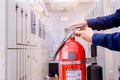 Engineer inspection Fire extinguisher in control room Royalty Free Stock Photo