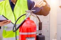 Engineer are checking and inspection a fire extinguishers tank Royalty Free Stock Photo