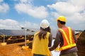 Engineer inspector male and female working in solar panel electric farm.photovoltaic cell park green energy concept Royalty Free Stock Photo