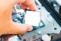 The engineer installing Central processing unit CPU on Motherboard Computer in Computer labs Royalty Free Stock Photo