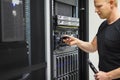 IT Engineer Installing Hard Drive In Rack Server Royalty Free Stock Photo