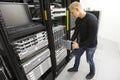 IT engineer installs blade server in datacenter Royalty Free Stock Photo
