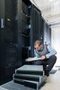 IT Engineer installs JBOD to rack in datacenter Royalty Free Stock Photo