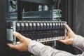 IT Engineer installs JBOD to rack in datacenter