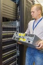 IT Engineer installs JBOD to rack in datacenter Royalty Free Stock Photo