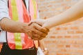 Engineer and investor shaking hands Royalty Free Stock Photo