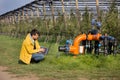 Engineer with irrigation system in orchard Royalty Free Stock Photo
