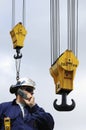 Engineer and large crane hooks Royalty Free Stock Photo