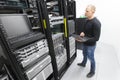 It engineer maintains servers in datacenter Royalty Free Stock Photo