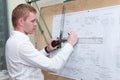 Engineer making a blueprint project with drawing board Royalty Free Stock Photo