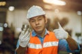 Engineer male worker showing best metal part for good quality steel lathe work production