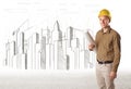 Engineer man with building city drawing in background Royalty Free Stock Photo