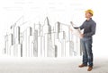 Engineer man with building city drawing in background Royalty Free Stock Photo