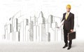 Engineer man with building city drawing in background Royalty Free Stock Photo