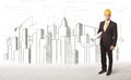 Engineer man with building city drawing in background Royalty Free Stock Photo