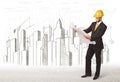 Engineer man with building city drawing in background Royalty Free Stock Photo