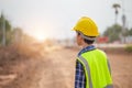 Engineer man checking project at site, Foreman worker with blueprints planning inspecting at road construction site Royalty Free Stock Photo