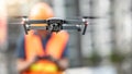 Engineer man flying drone over construction site Royalty Free Stock Photo