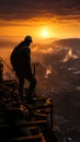 Engineer man silhouette on sunset building construction. Worker on construction site Royalty Free Stock Photo