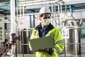 Engineer man, is using a notebook computer at workplace Which is an industrial factory Royalty Free Stock Photo
