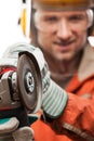 Engineer or manual worker man in safety hardhat helmet holding a Royalty Free Stock Photo