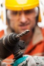 Engineer or manual worker man in safety hardhat helmet holding h Royalty Free Stock Photo