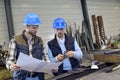 Engineer with mechanical worker checking on production quality Royalty Free Stock Photo