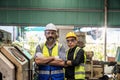 Engineer with monitor checking quality result of work. Man technician is working in a steel factory Royalty Free Stock Photo