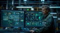 Engineer Monitoring Advanced Systems on Multiple Screens
