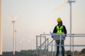 Engineer at natural energy wind turbine site with a mission to climb up to the wind turbine blades