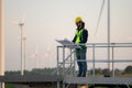 Engineer at natural energy wind turbine site with a mission to climb up to the wind turbine blades