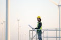 Engineer at natural energy wind turbine site with a mission to climb up to the wind turbine