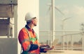 Engineer at natural energy wind turbine site Must use a computer to control Royalty Free Stock Photo