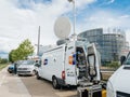 Engineer near Media TV truck van parked in front of Parliament E