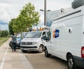 Engineer near Media TV truck van parked in front of Parliament E