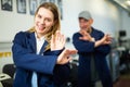 Engineer and office worker having fun dancing in print shop Royalty Free Stock Photo