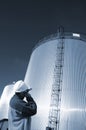 Engineer and oil tanks Royalty Free Stock Photo