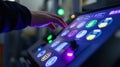 Engineer operating futuristic touchscreen control panel in factory