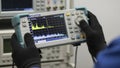 Engineer operating a portable spectrum analyzer for electronic testing and measurement Royalty Free Stock Photo