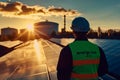 Engineer overlooking solar panel array at sunset Clean energy sustainability and future-focused technology Royalty Free Stock Photo