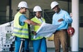 Engineer people, blueprint and documents in team construction, planning or strategy on site. Architect group in teamwork Royalty Free Stock Photo