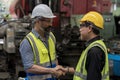 Engineer people Happy to be successful partnership team. Smiling Engineer shaking hands. Metal Machine Royalty Free Stock Photo
