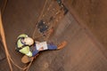 Engineer planer working at height abseiling into the chute, writing, drawing defected, faulty, damage liners his planning book Royalty Free Stock Photo