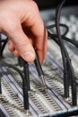 Engineer Plugging Cable Into Patch Panel Royalty Free Stock Photo