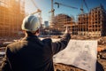 Engineer pointing at unfinished building. Generative AI