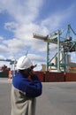 Engineer with port and crane Royalty Free Stock Photo