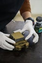 Engineer preparing a soil sample in a mold for direct shear laboratory test