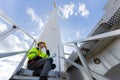 Engineer professional techician male working using laptop setup wind turbines system control operate service at location site Royalty Free Stock Photo