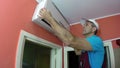 Engineer Repairing Air Conditioner