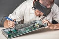 Engineer repairing circuit board